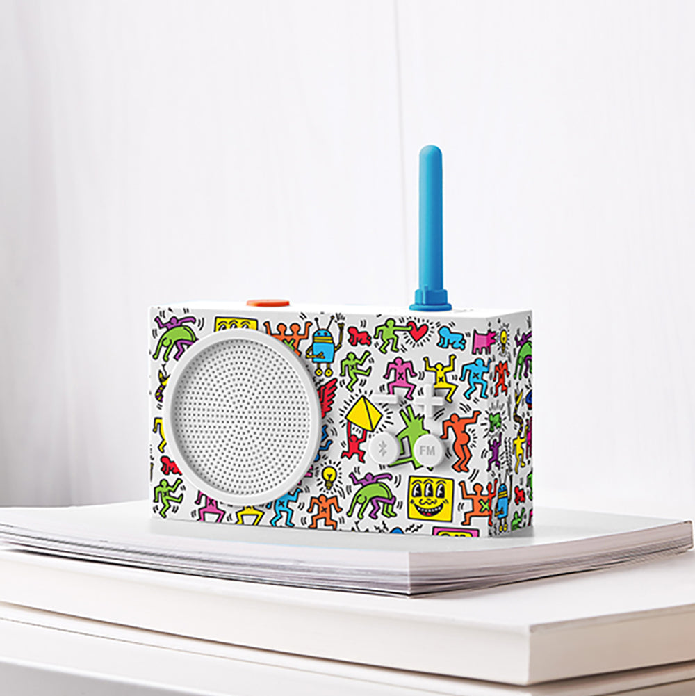 Colorful retro-style radio on a white surface with a white background